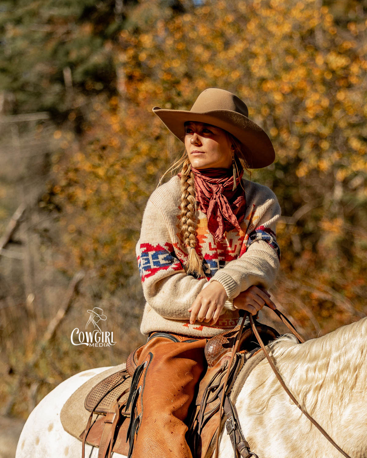 Cowgirl in the woods with fall colors